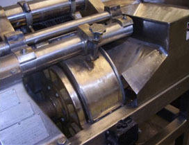 Machines for cutting and grinding products